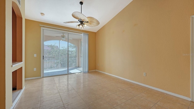 tiled empty room featuring lofted ceiling and ceiling fan