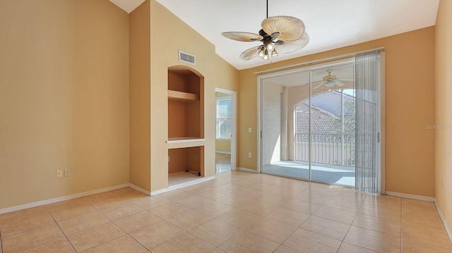 tiled spare room with built in features, vaulted ceiling, and ceiling fan