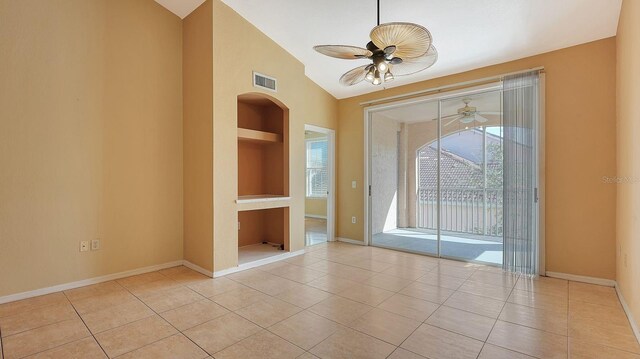 4134 Central Sarasota Pkwy Unit 1734, Sarasota, FL 34238 - tiled empty room featuring built in features, a ceiling fan, vaulted ceiling, and baseboards