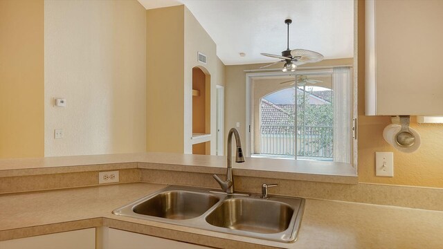 4134 Central Sarasota Pkwy Unit 1734, Sarasota, FL 34238 - kitchen with a sink, a ceiling fan, and light countertops