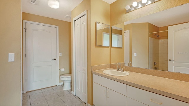 full bathroom featuring tile patterned flooring, vanity, toilet, and bathtub / shower combination