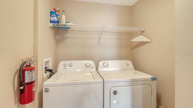 laundry room with washing machine and clothes dryer