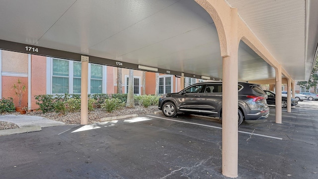 view of parking with a carport