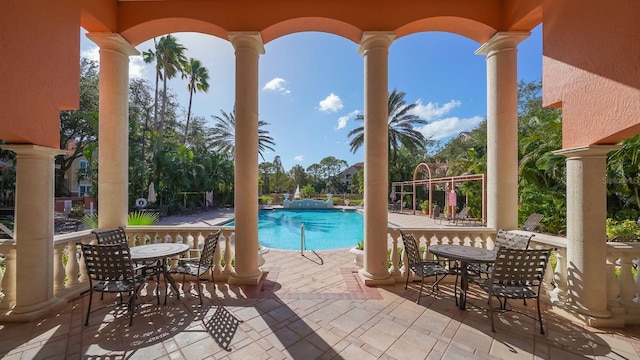 view of swimming pool featuring a patio area