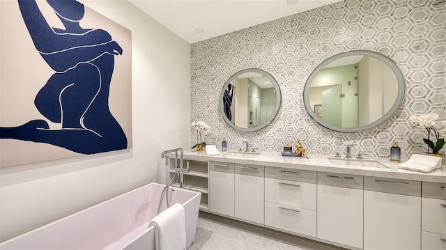 bathroom with vanity and a washtub