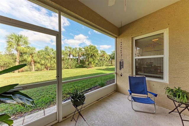 sunroom with ceiling fan and a healthy amount of sunlight