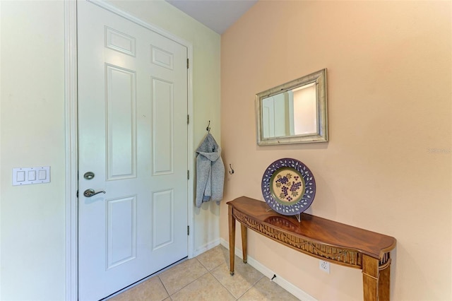 entryway with light tile patterned floors