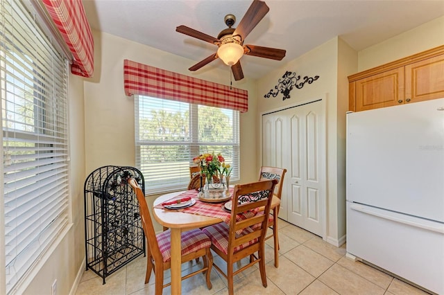 dining room featuring ceiling fan and light tile patterned floors