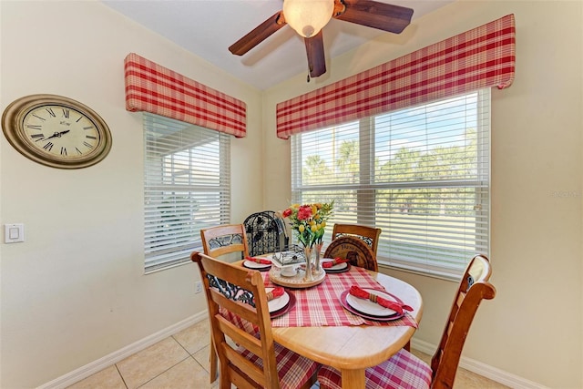 tiled dining room featuring ceiling fan