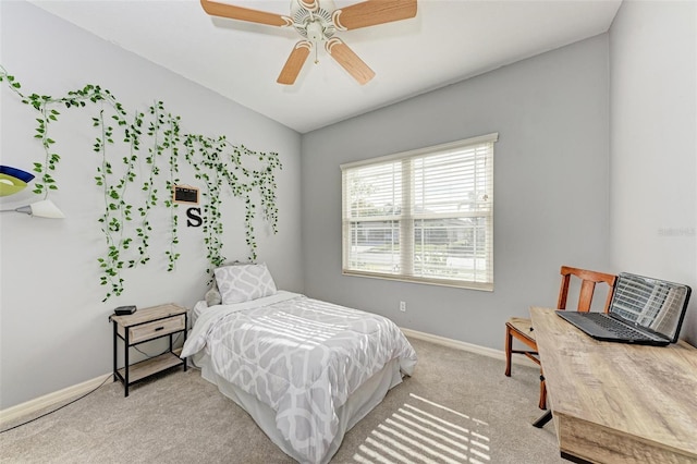 bedroom with light colored carpet and ceiling fan