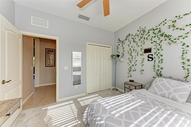 tiled bedroom with a closet and ceiling fan