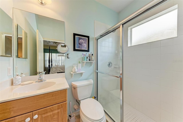 bathroom with vanity, toilet, and walk in shower