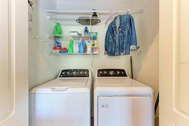 laundry area with separate washer and dryer