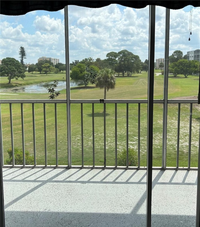 unfurnished sunroom with a water view