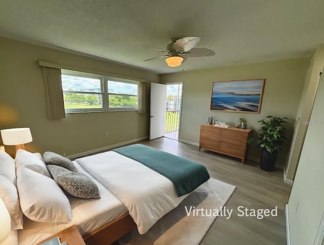 bedroom with ceiling fan, light hardwood / wood-style flooring, and access to outside