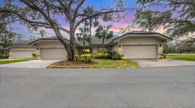 ranch-style home featuring a garage