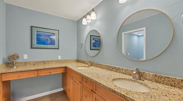 bathroom with tile patterned flooring and vanity