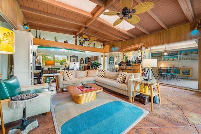 living room featuring ceiling fan and lofted ceiling with beams