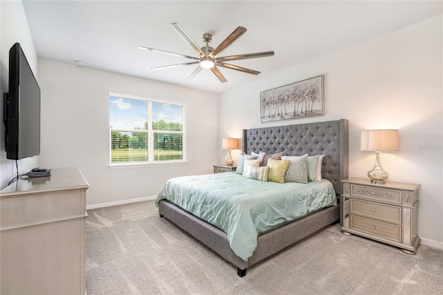 bedroom featuring ceiling fan and light colored carpet