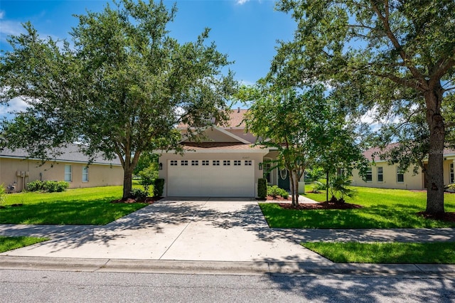 view of front of property with a garage and a front yard