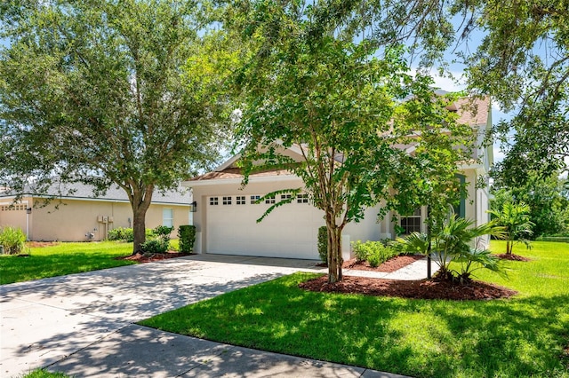 view of front of house featuring a garage and a front lawn