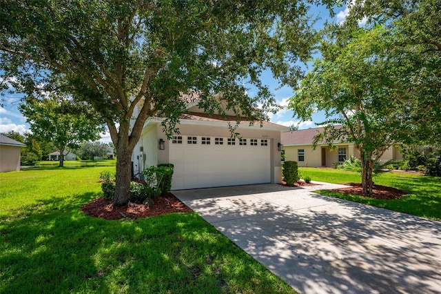 view of front of property featuring a garage and a front lawn