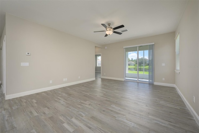 unfurnished room with ceiling fan and light hardwood / wood-style flooring