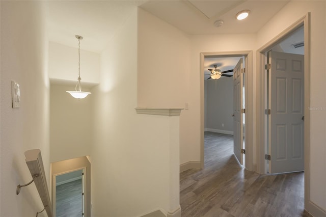 corridor with dark hardwood / wood-style floors