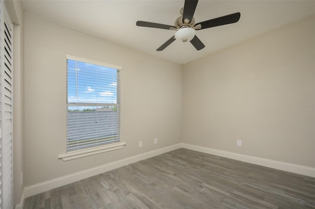 spare room featuring hardwood / wood-style floors and ceiling fan