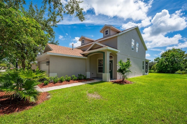 view of front of property featuring a garage and a front lawn