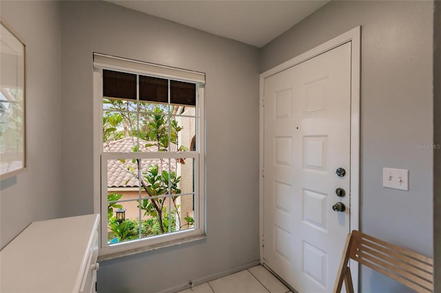 entryway with light tile patterned floors