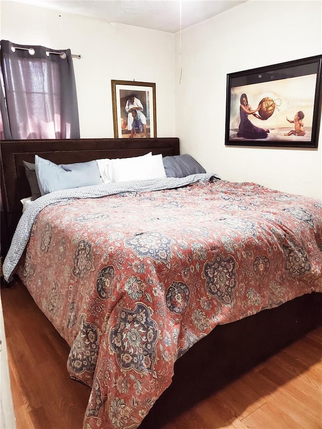 bedroom featuring wood-type flooring