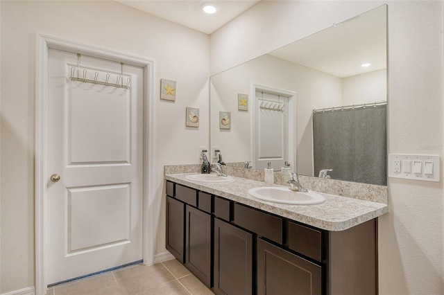 bathroom with vanity and tile patterned flooring