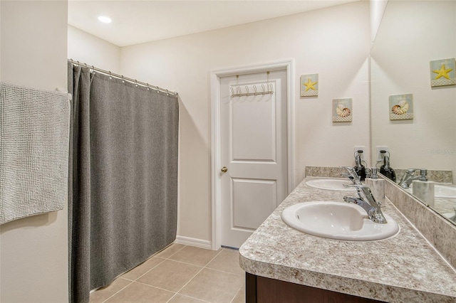 bathroom with tile patterned flooring and vanity