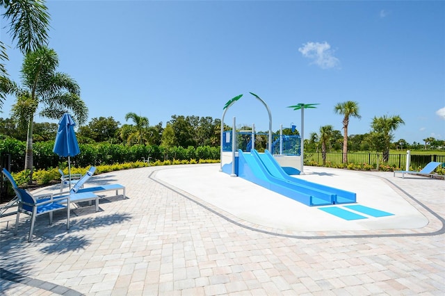 view of swimming pool with a patio area