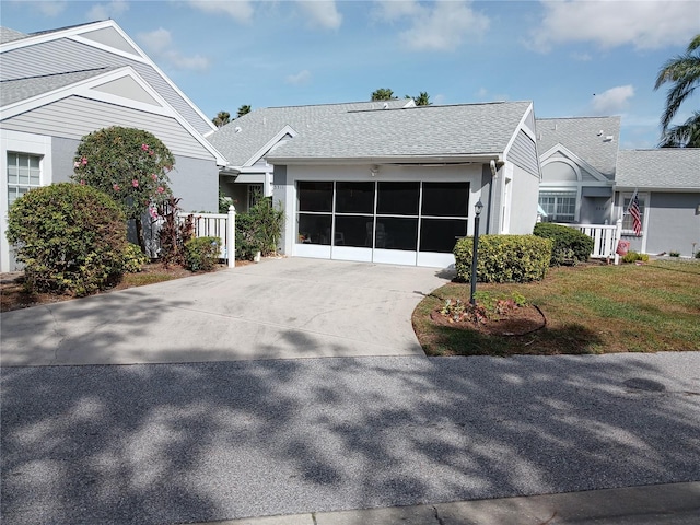 view of front facade featuring a front lawn and a garage