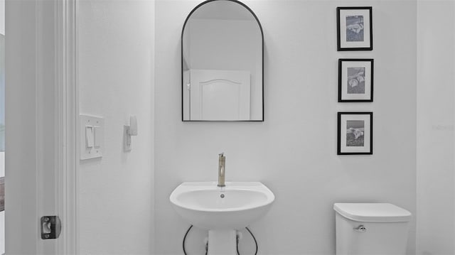 bathroom featuring sink and toilet