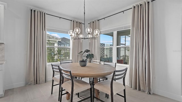 dining room with a notable chandelier and light tile patterned floors