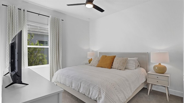 carpeted bedroom with ceiling fan