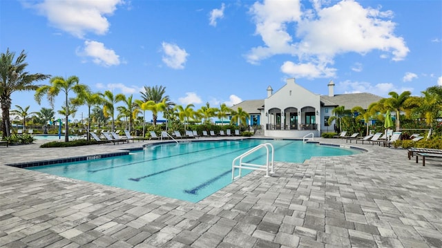 view of swimming pool with a patio