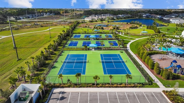 birds eye view of property with a water view