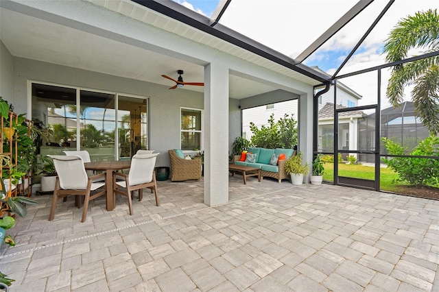 sunroom featuring ceiling fan