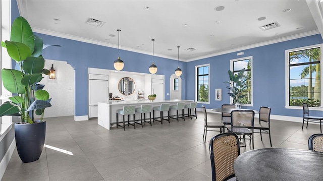 dining area with crown molding