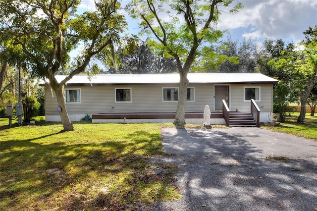 view of front of home with a front lawn