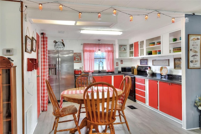 kitchen featuring light hardwood / wood-style floors, sink, and appliances with stainless steel finishes