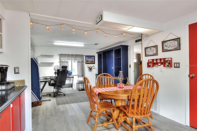 dining area with hardwood / wood-style floors