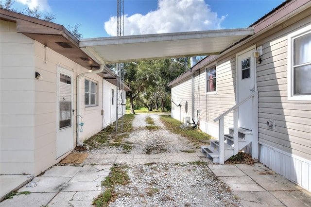 view of side of property featuring a carport