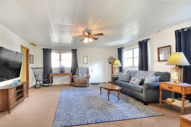 living room with carpet floors, plenty of natural light, and ceiling fan