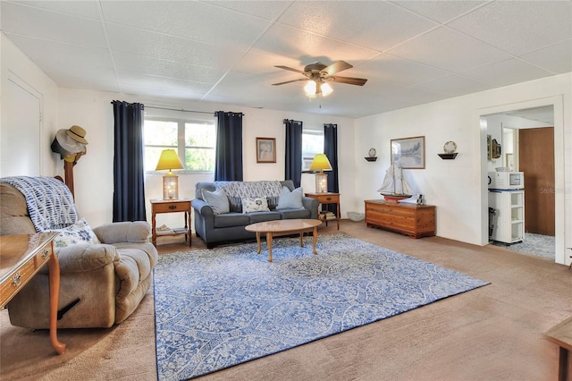 living room with carpet flooring and ceiling fan