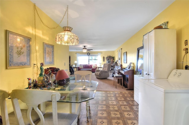 dining area with ceiling fan and washer / dryer